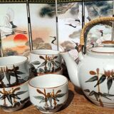 Asian set of a teapot and its cups
