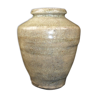 Ancient vase in khaki grey-green cracked sandstone
