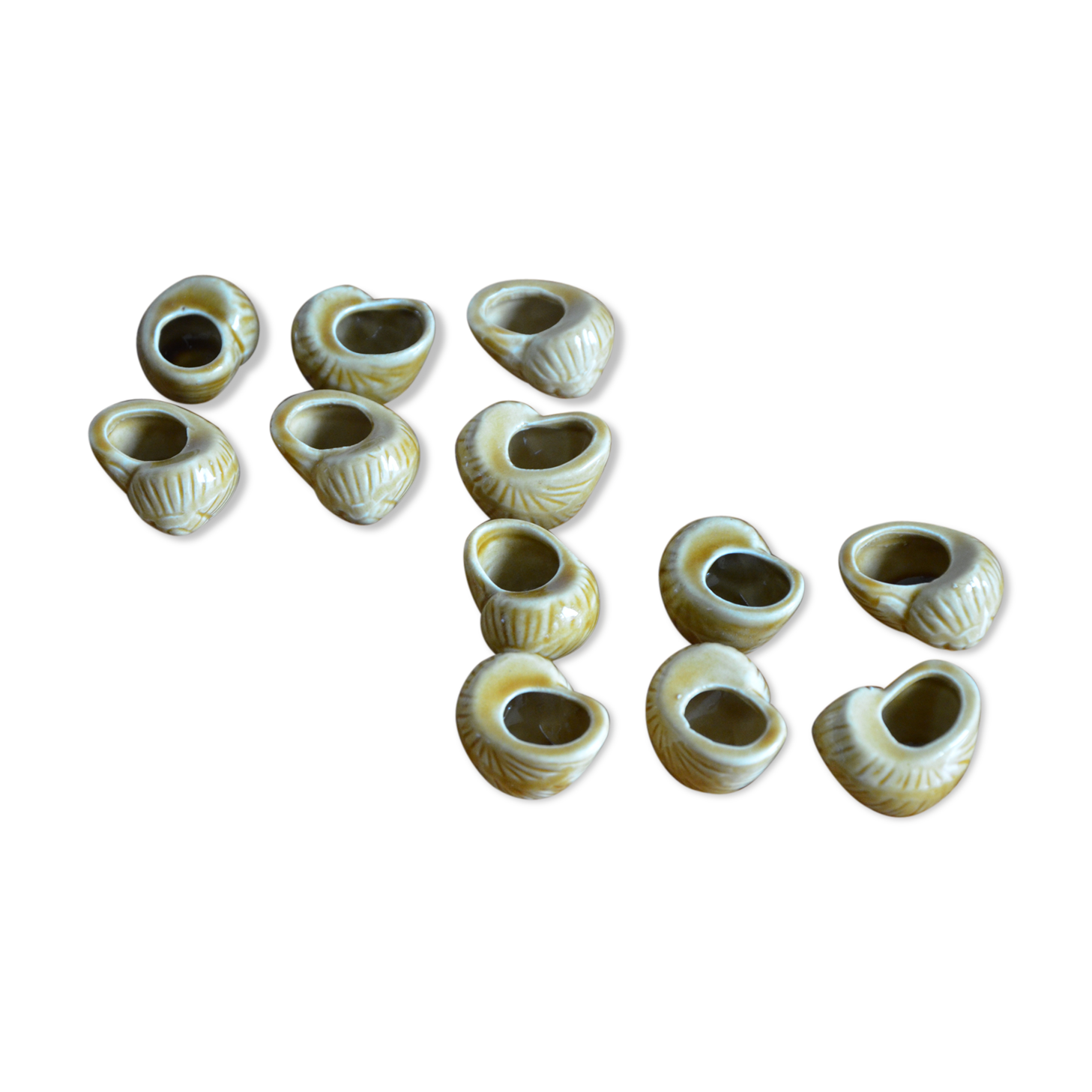 Lot of 12 enamelled sandstone snail shells
