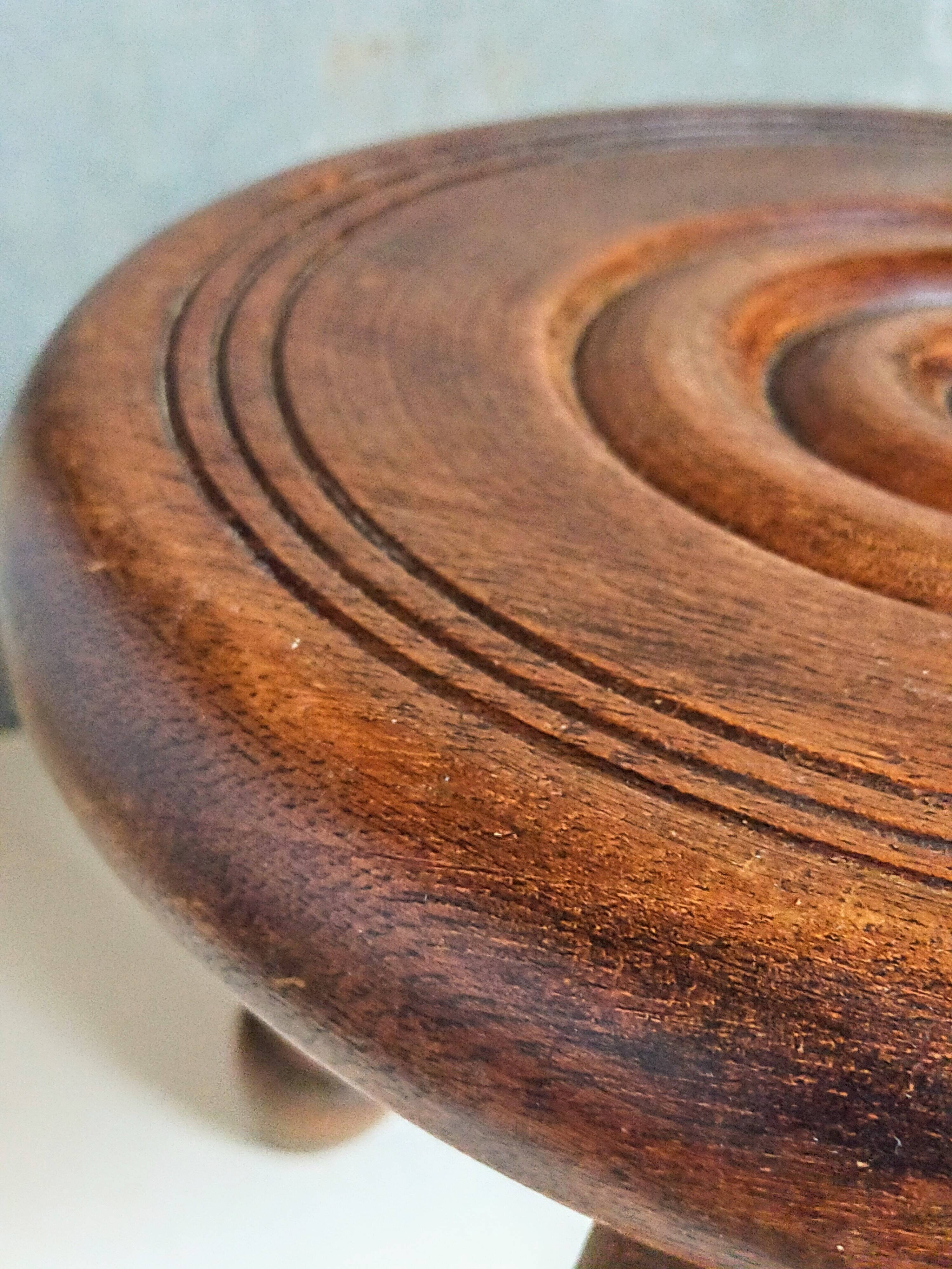 Low tripod stool in vintage turned solid wood