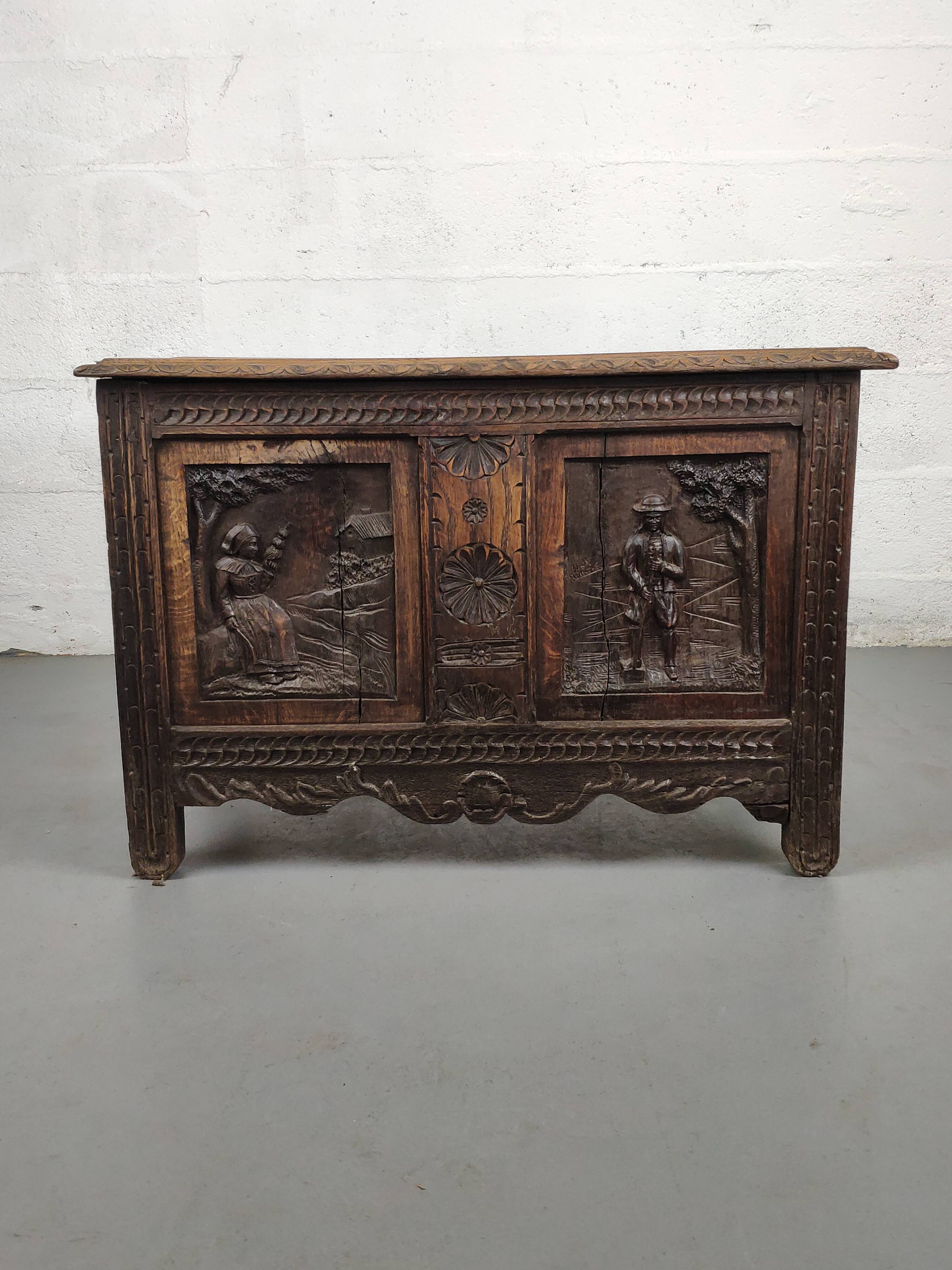 Old storage chest oak carved traditional scene
