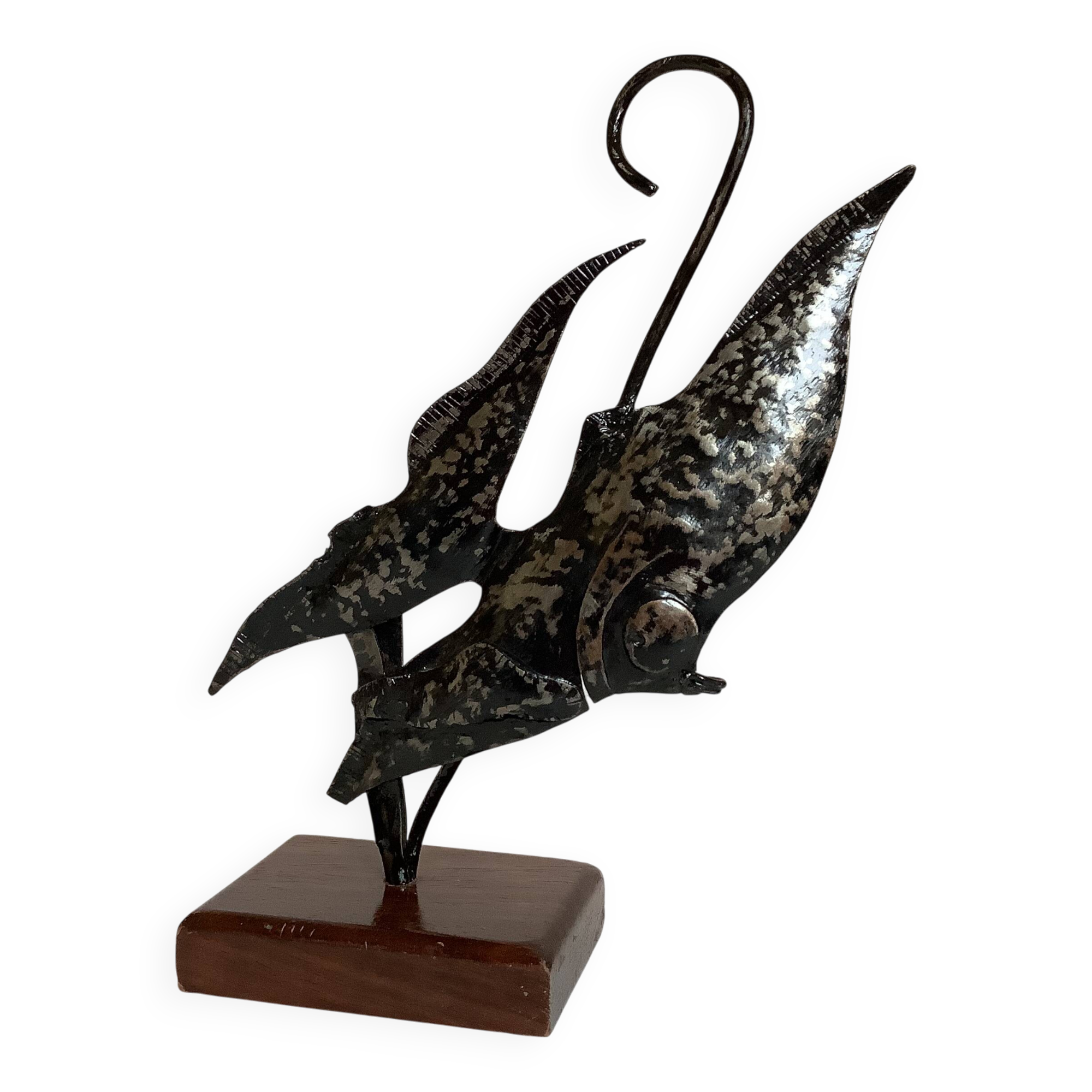 Small metal and wood fish statue