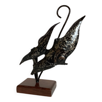 Small metal and wood fish statue