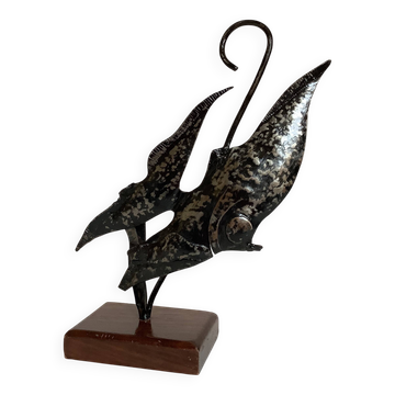 Small metal and wood fish statue