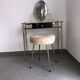 Brass hairdresser, glass and black plastic with its fluffy stool.