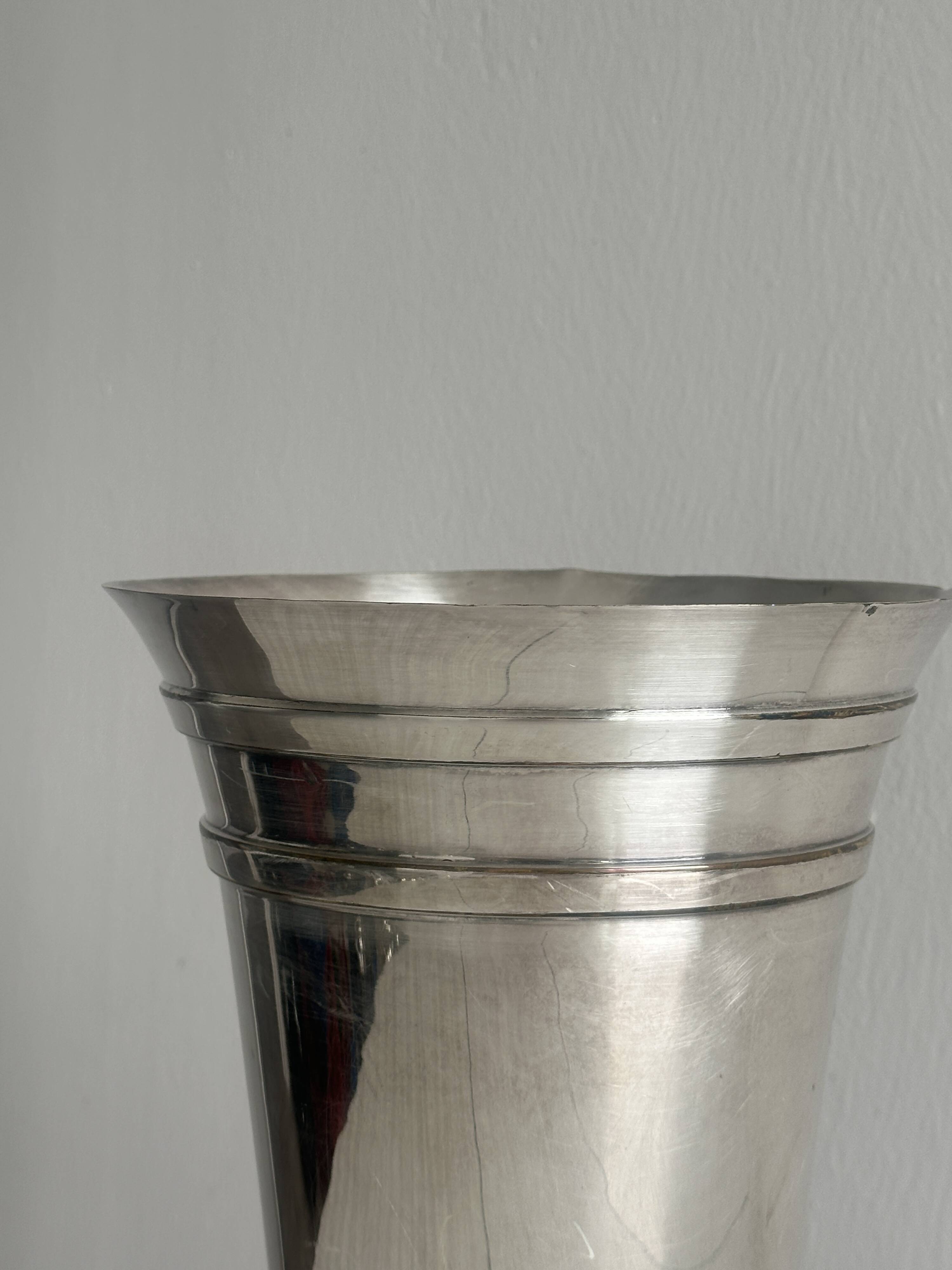 Antique shiny metal vase