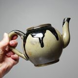 A pair of small vintage teapots in the Art Deco style reminiscent of Denbac.