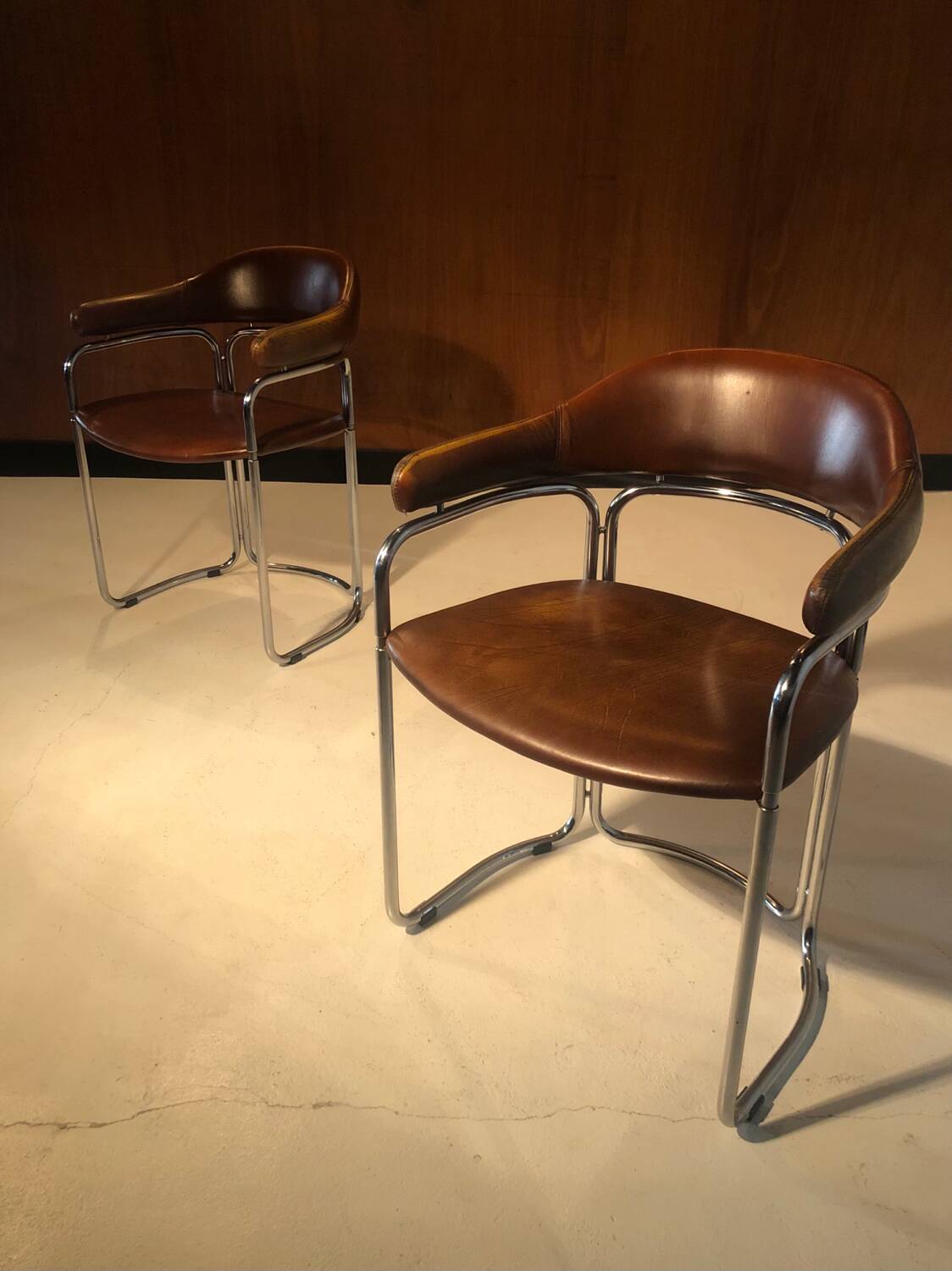 Pair of vintage armchairs, cognac leather and chrome steel 1970