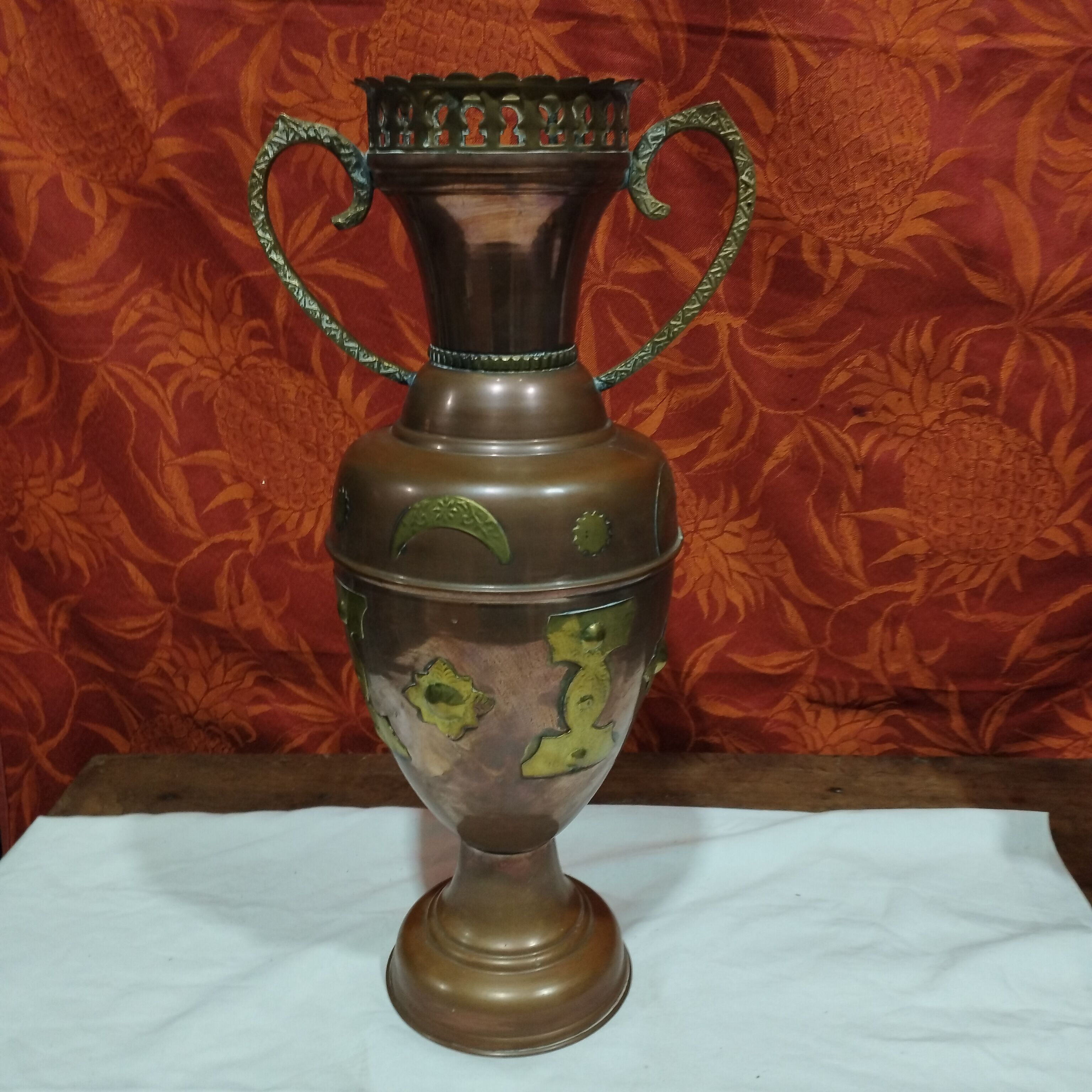 Oriental style vase or copper amphora and brass decoration