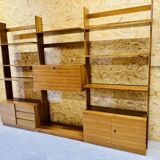 Modular wall-mounted bookcase in walnut