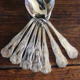 A set of 7 large metal shell spoons