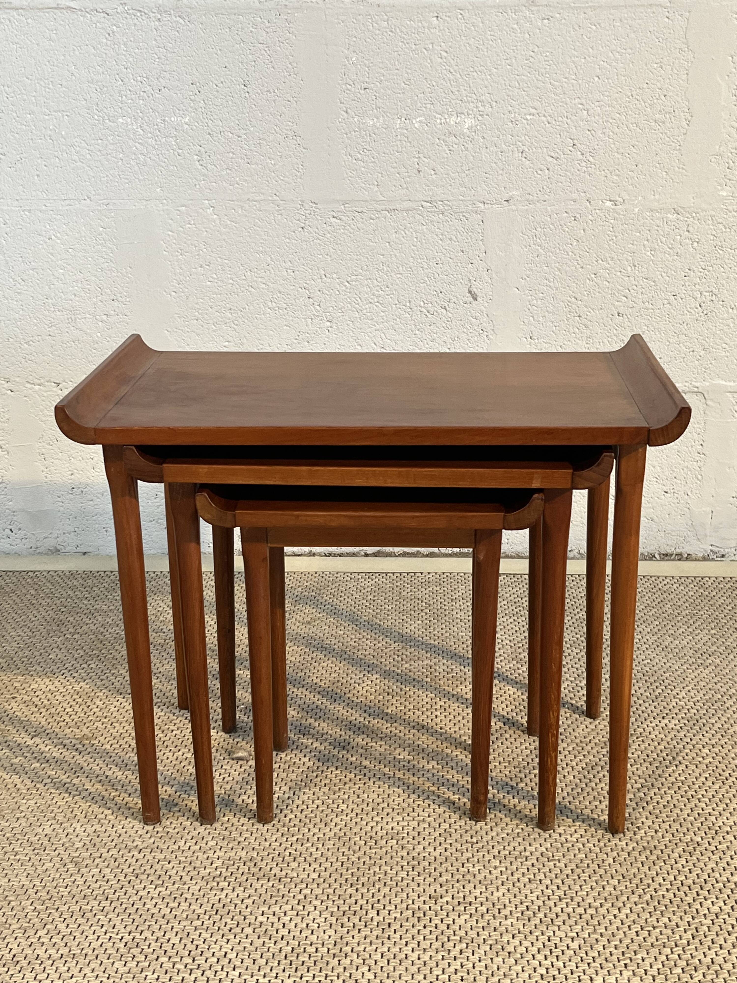 Set of three nesting low tables in a Japanese style, made of mahogany.
