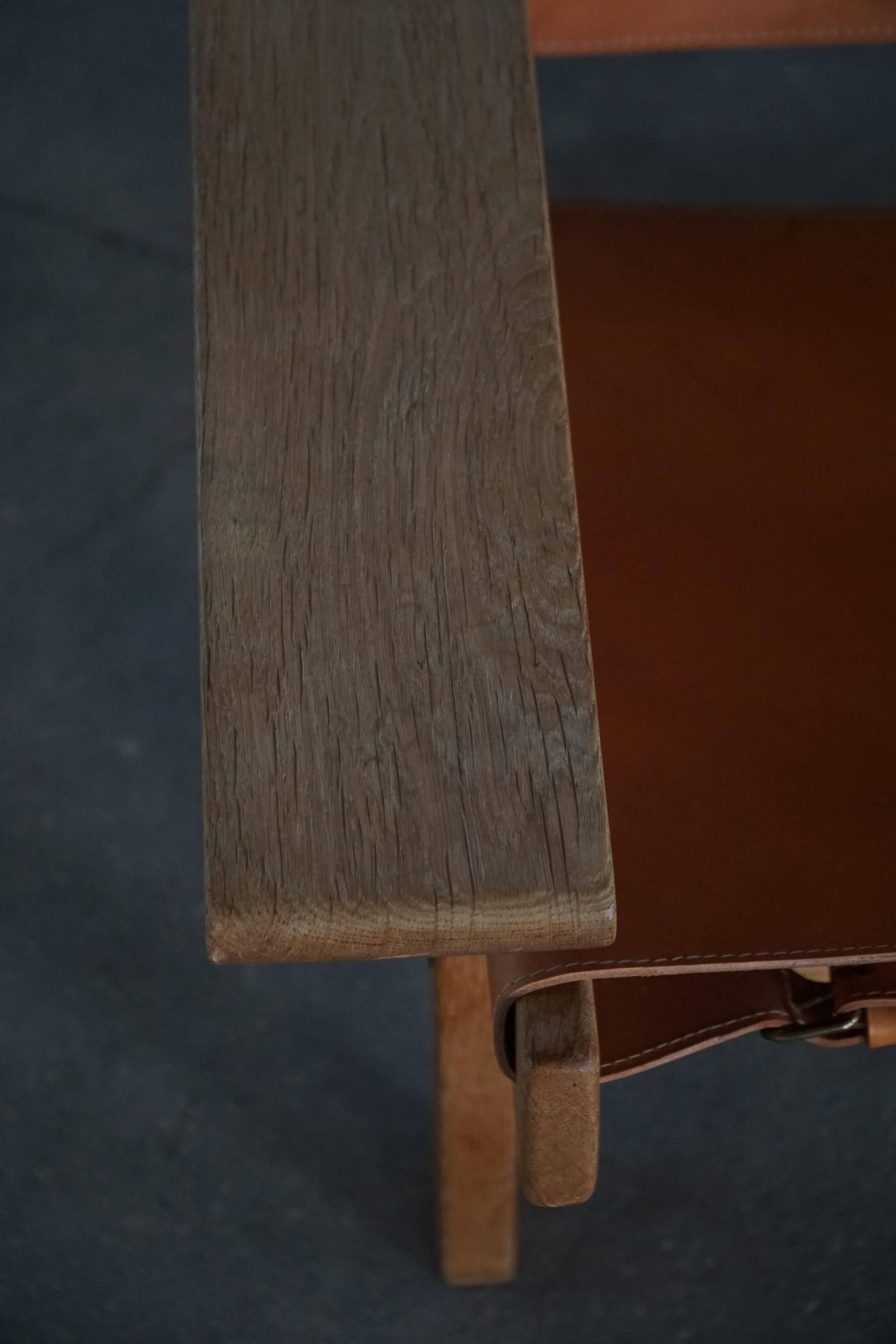 Pair of oak and leather hunting chairs by Kurt Østervig, modern Danish style from the 1960s.