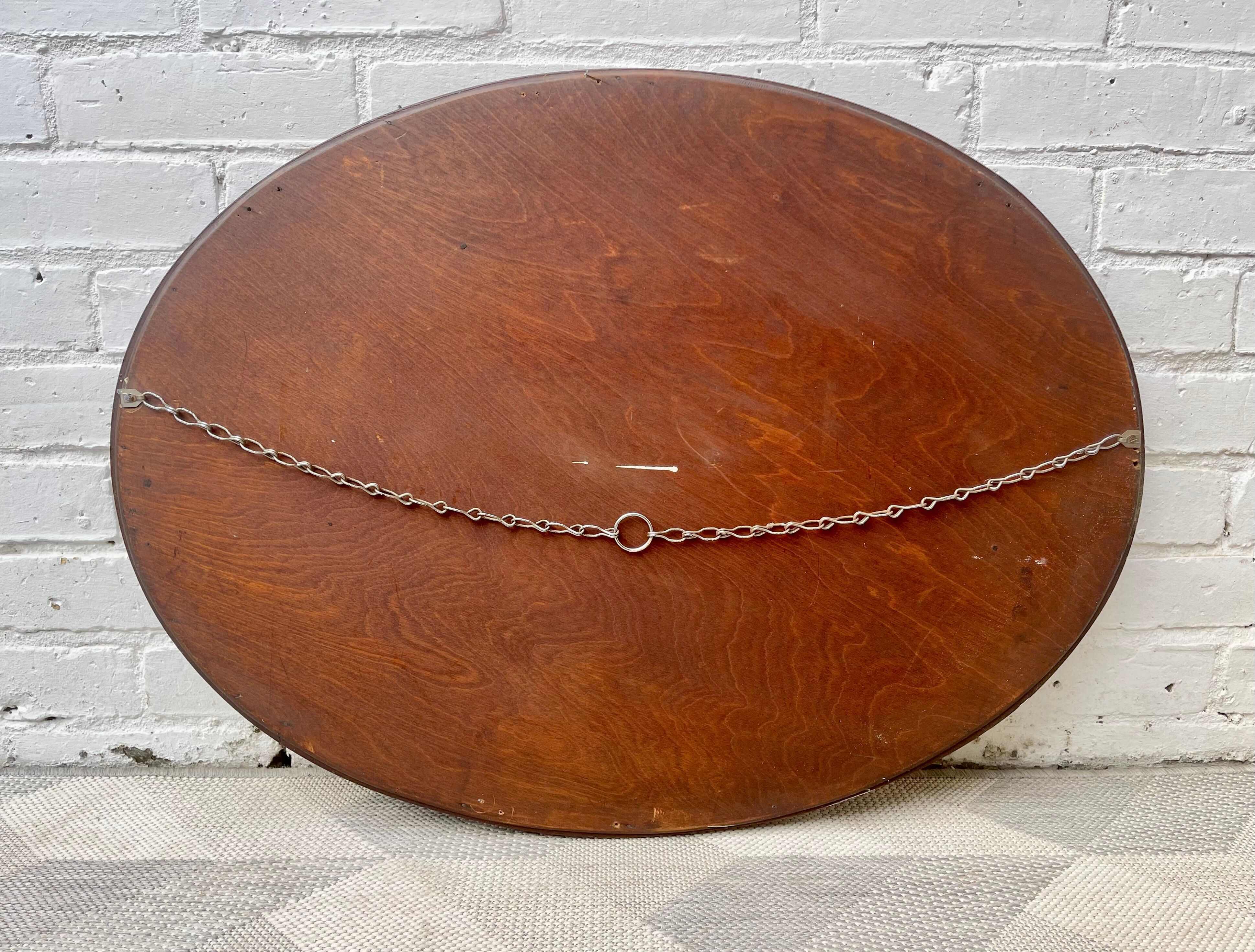 Vintage oval bevelled mirror mahogany frame