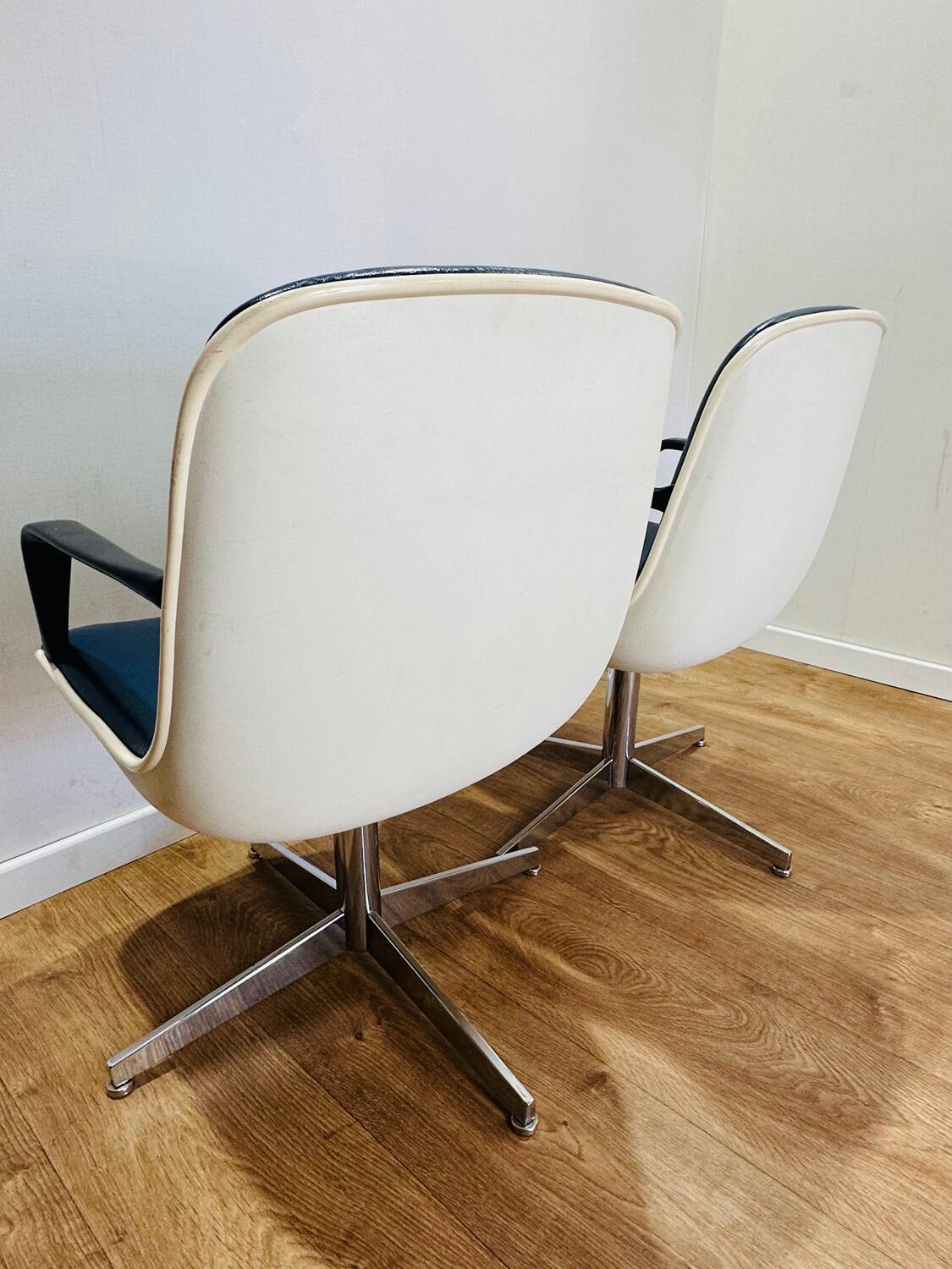 2 office chairs attr. to Strafor, white molded plastic shell, blue skai and chrome metal star base