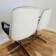 2 office chairs attr. to Strafor, white molded plastic shell, blue skai and chrome metal star base