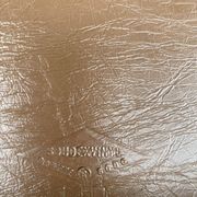Set of 4 vintage camel faux leather quilted chairs with chrome metal by Soudexvinyl from the 70s.