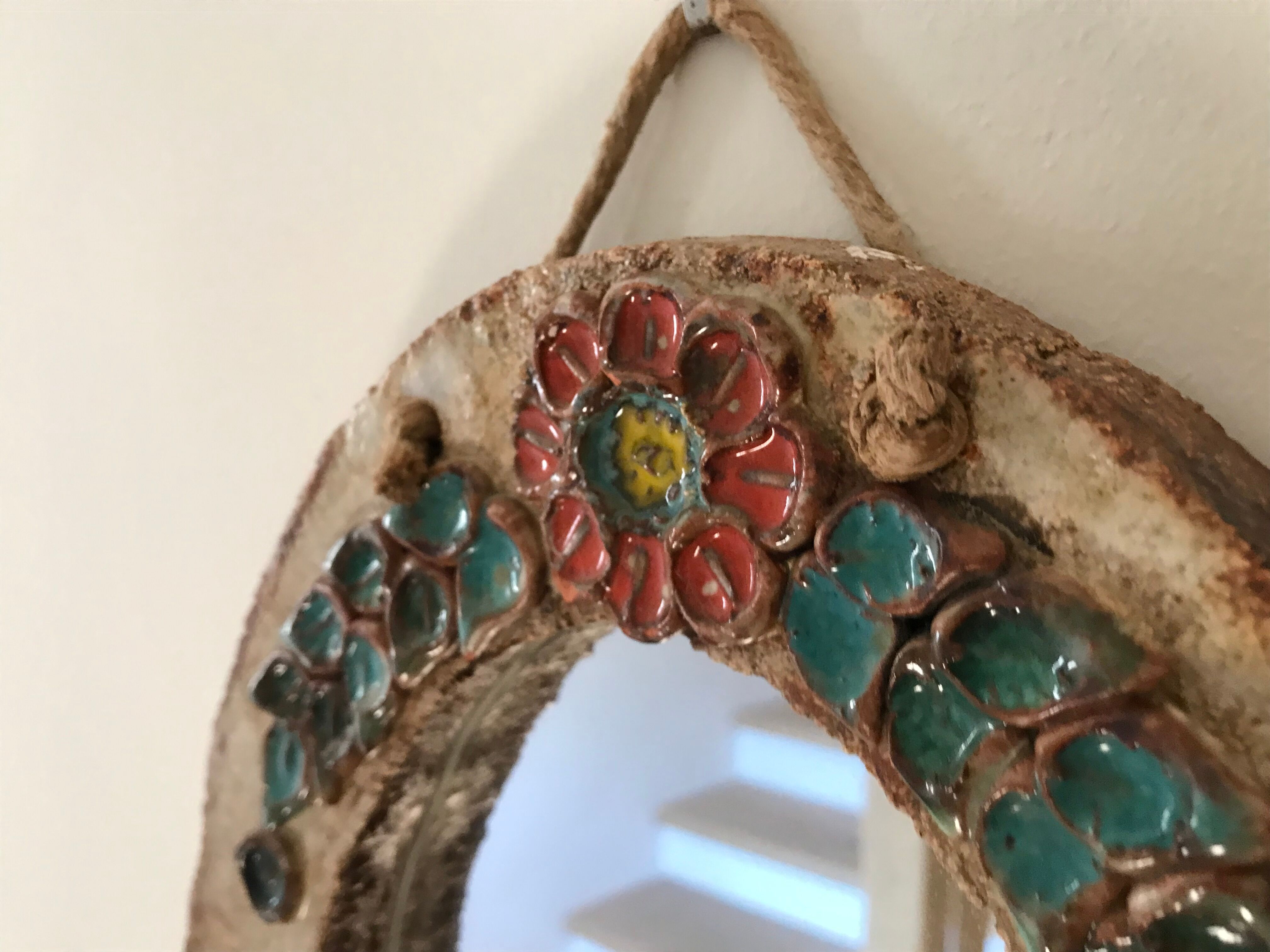 Ceramic mirror decorated with flowers, circa 1960 25x40cm