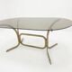 Silver metal table with smoked glass top from the 1970s.