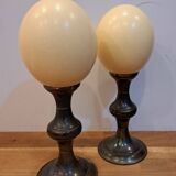 pair of ostrich eggs mounted on a metal base