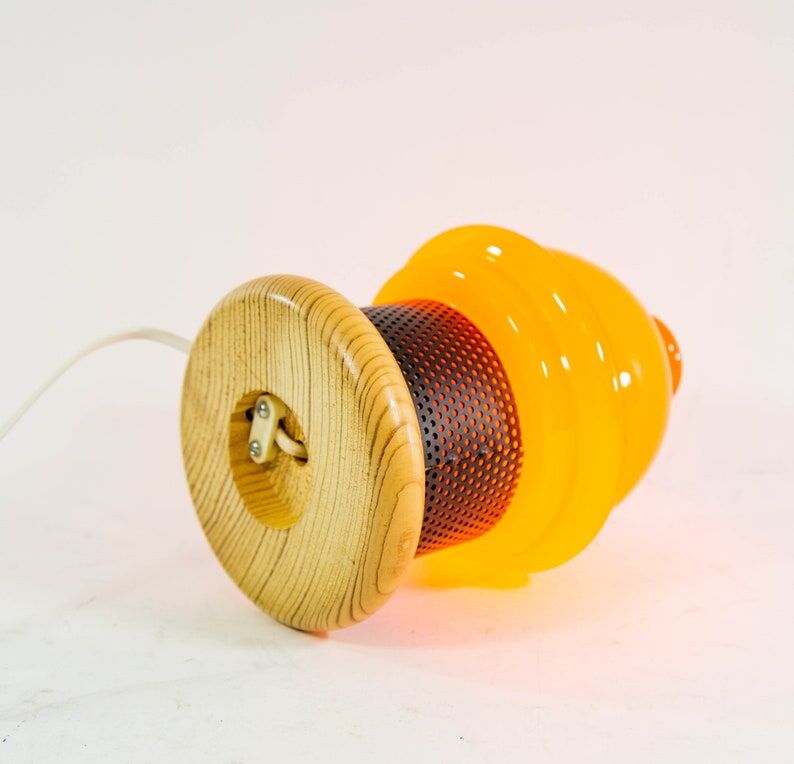 Vintage table lamp in orange glass and black perforated metal 70s