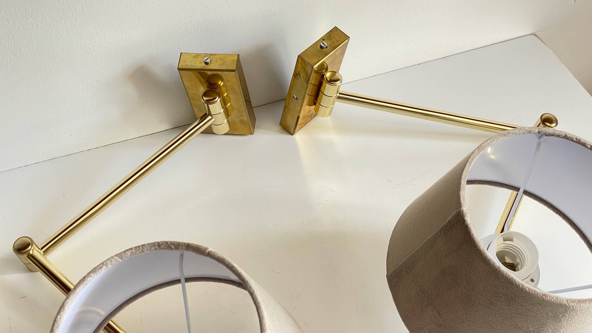 articulated brass and velvet wall light