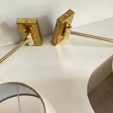 articulated brass and velvet wall light