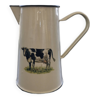 Metal jug with cow decor