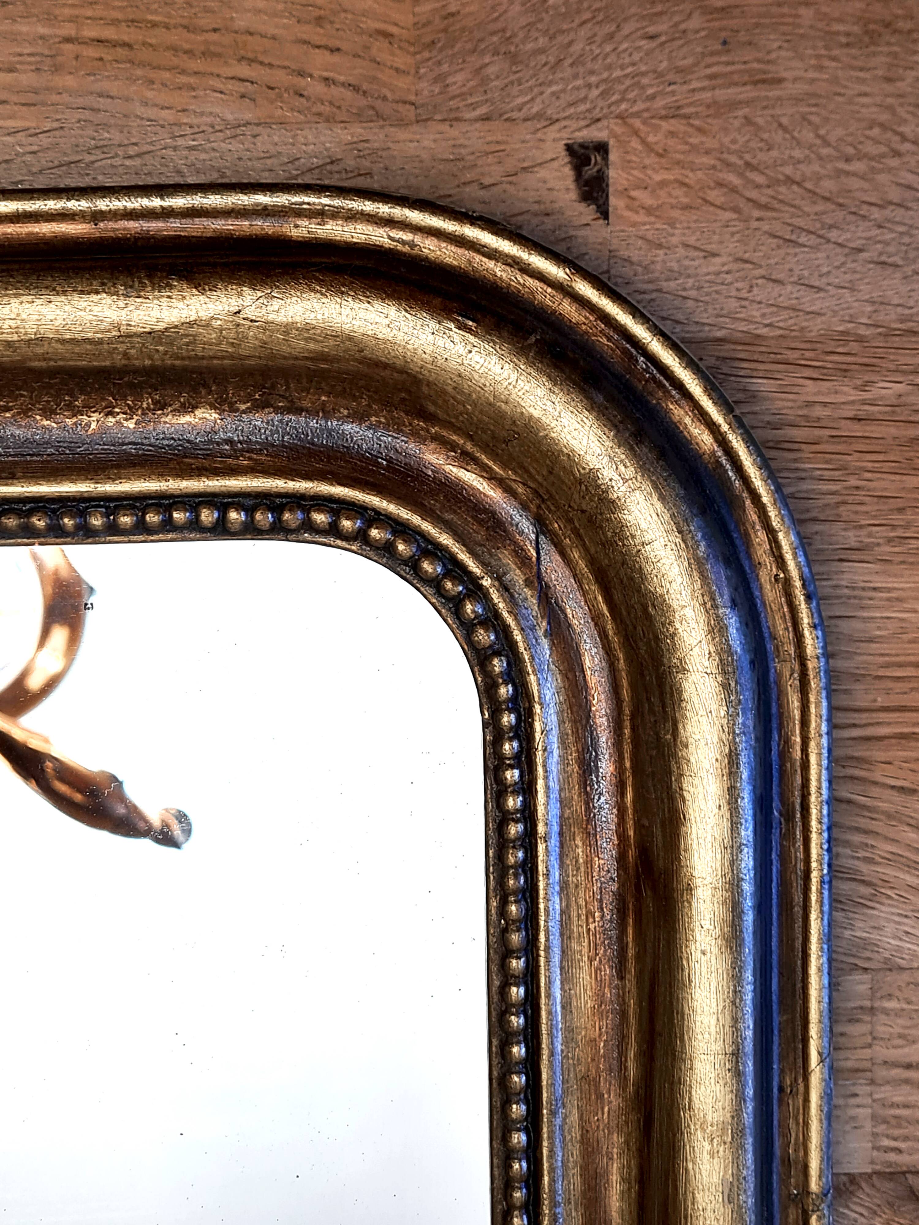 Antique Louis-Philippe gilded mirror “Apoline”