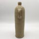 Old hot water bottle in glazed stoneware, beige color
