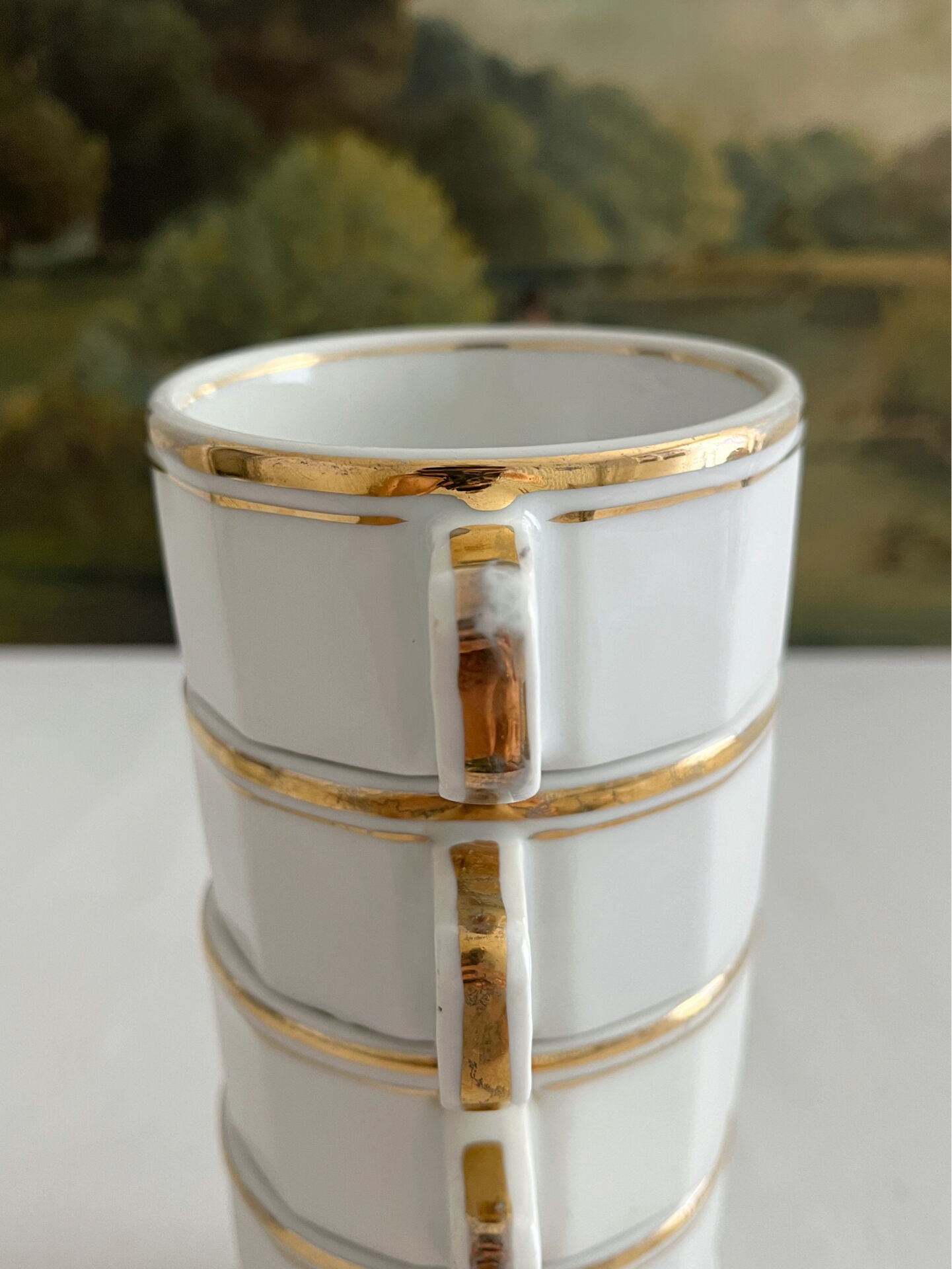 5 vintage porcelain bistro coffee cups from Paris with gold trim.