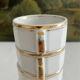 5 vintage porcelain bistro coffee cups from Paris with gold trim.