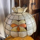 Mother-of-pearl and brass pendant with floral decoration.