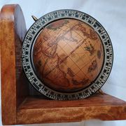 Pair of vintage bookends with rotating terrestrial globes on wooden bases in Spain
