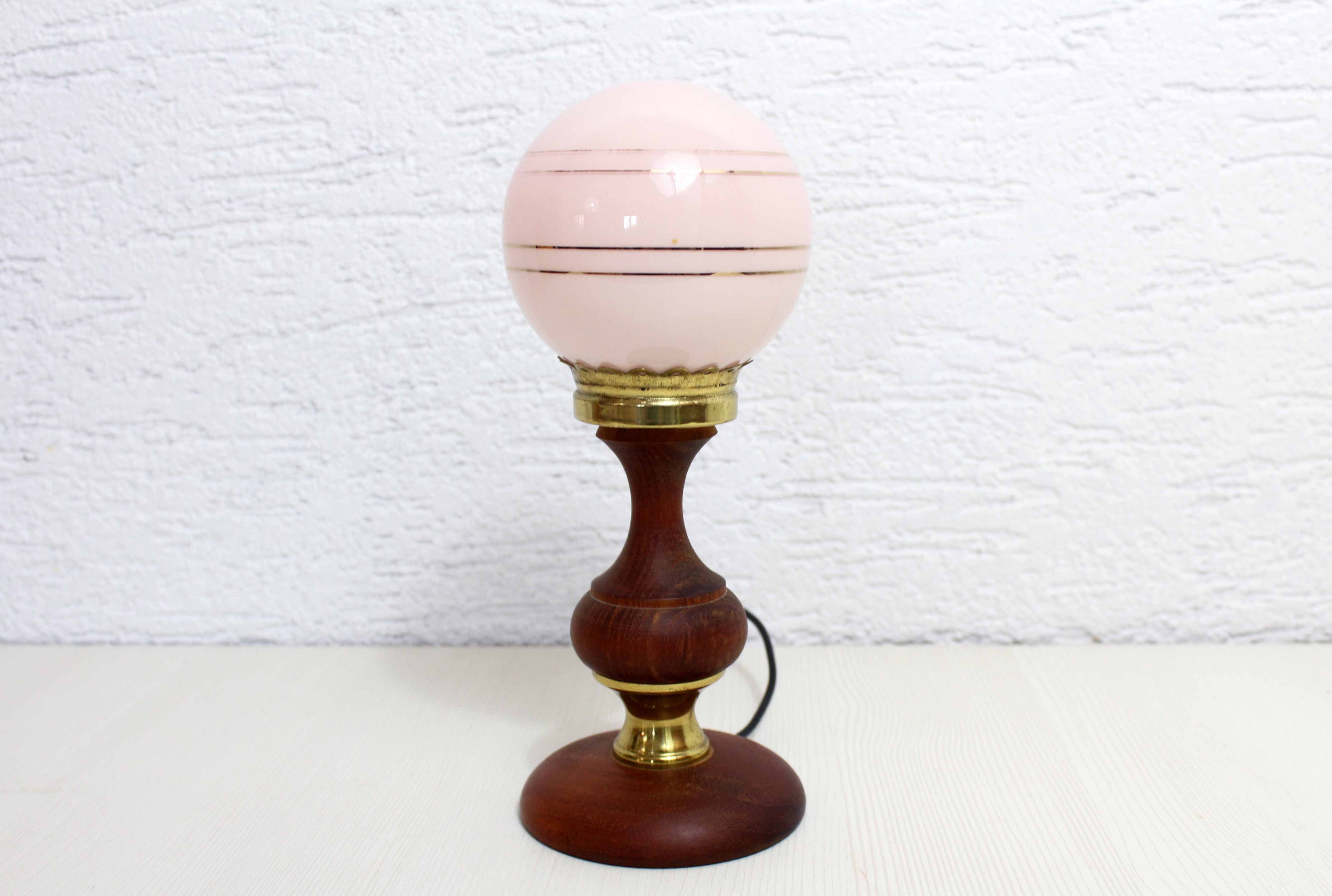 Turned wood and pink glass lamp
