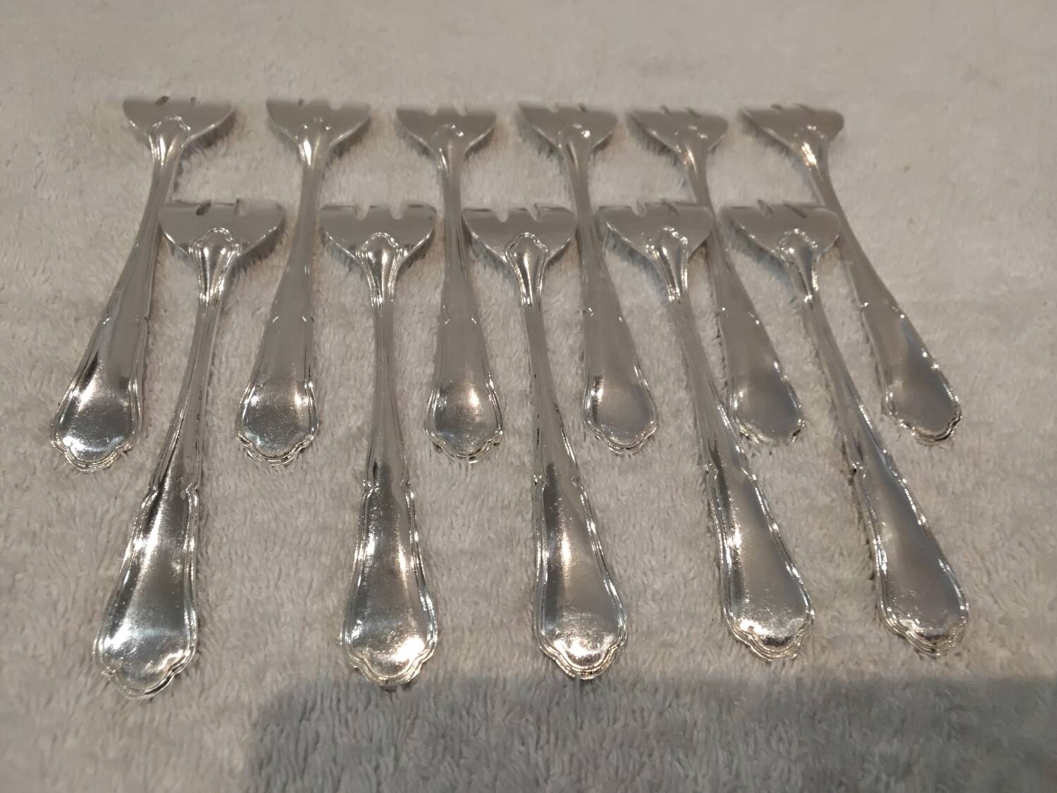 11 silver-plated oyster forks by Orbrille, 13.2cm