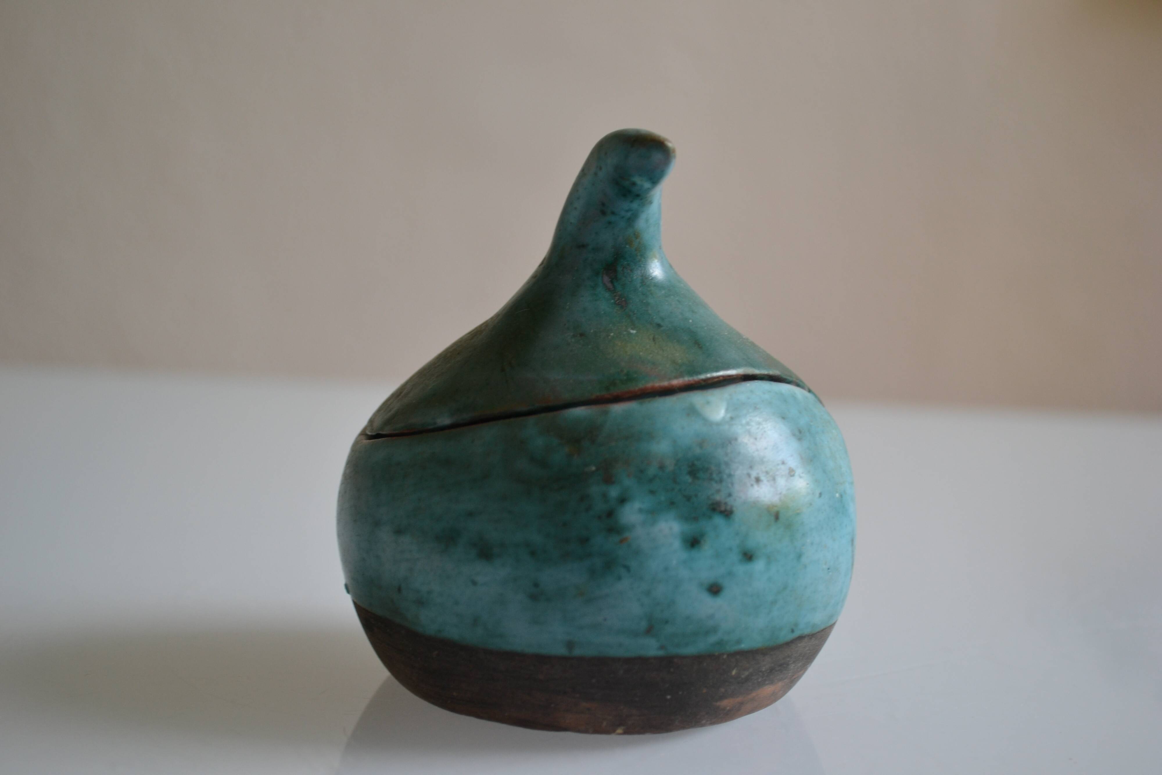 Signature ceramic fish-covered pot to identify.