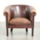 Sheepskin club armchair with patina in a subtle size and a vintage look