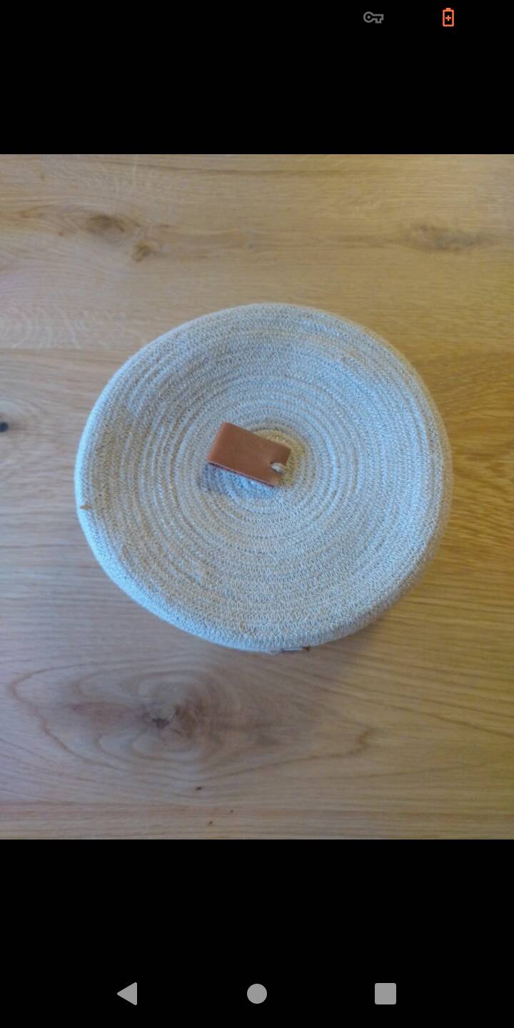 Basket with braided rope and leather lid