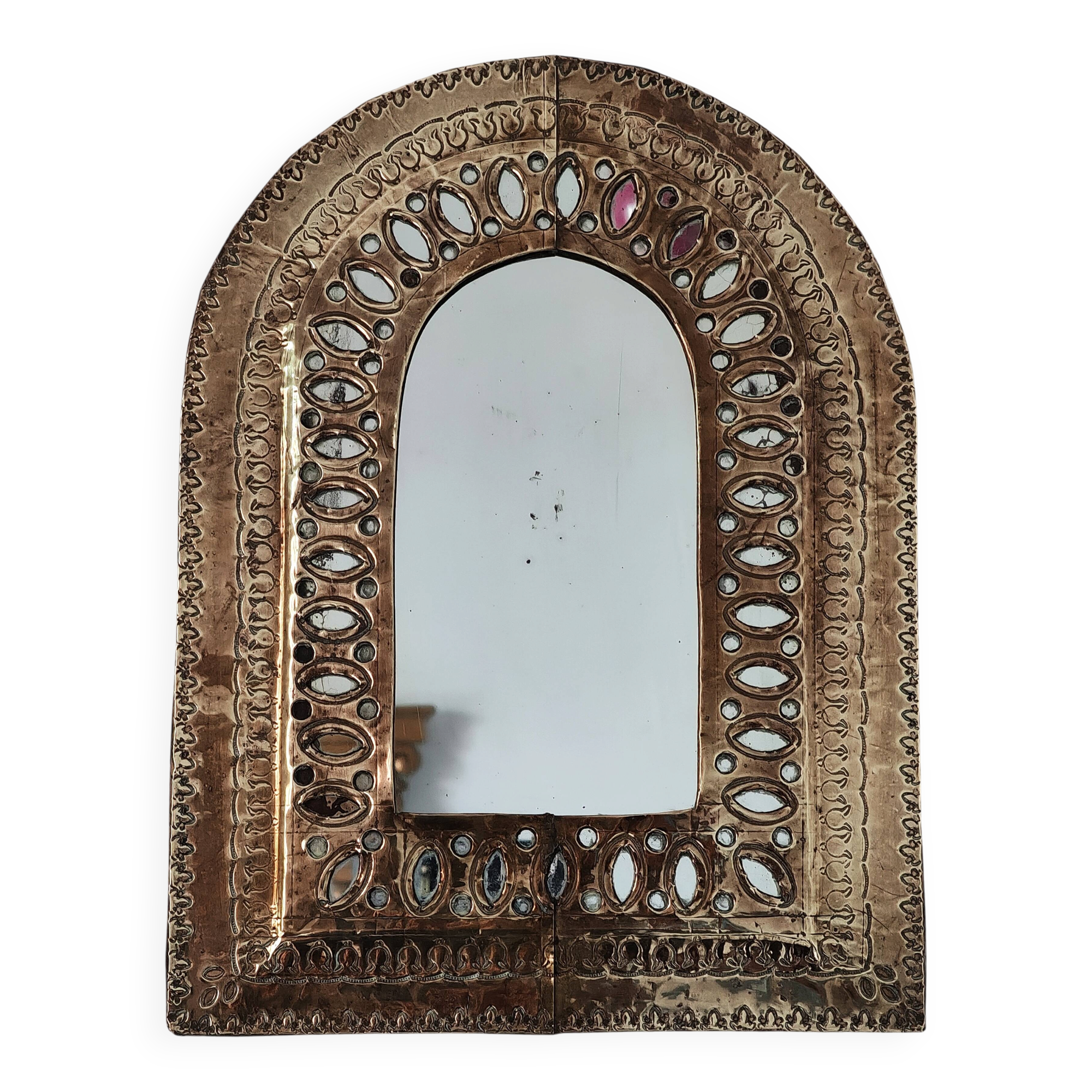 Small golden metal mirror in oriental style.