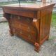 Restoration period walnut chest of drawers with a scroll handle