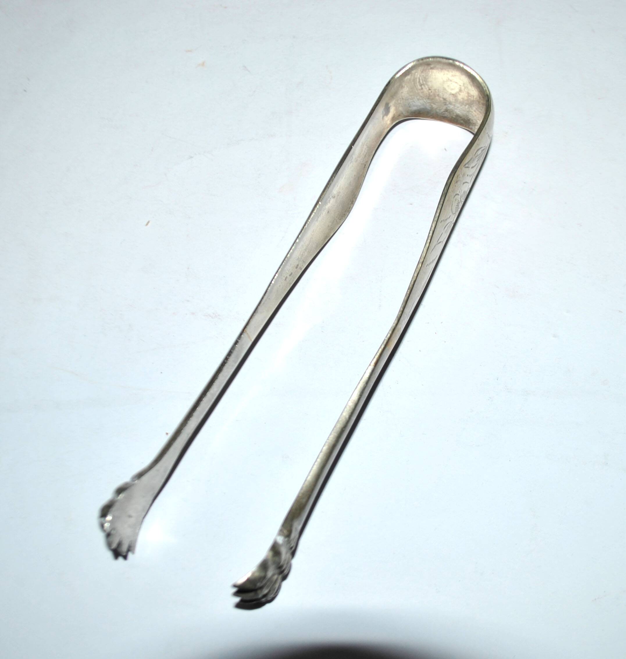 Vintage engraved silver metal lion claw sugar tongs