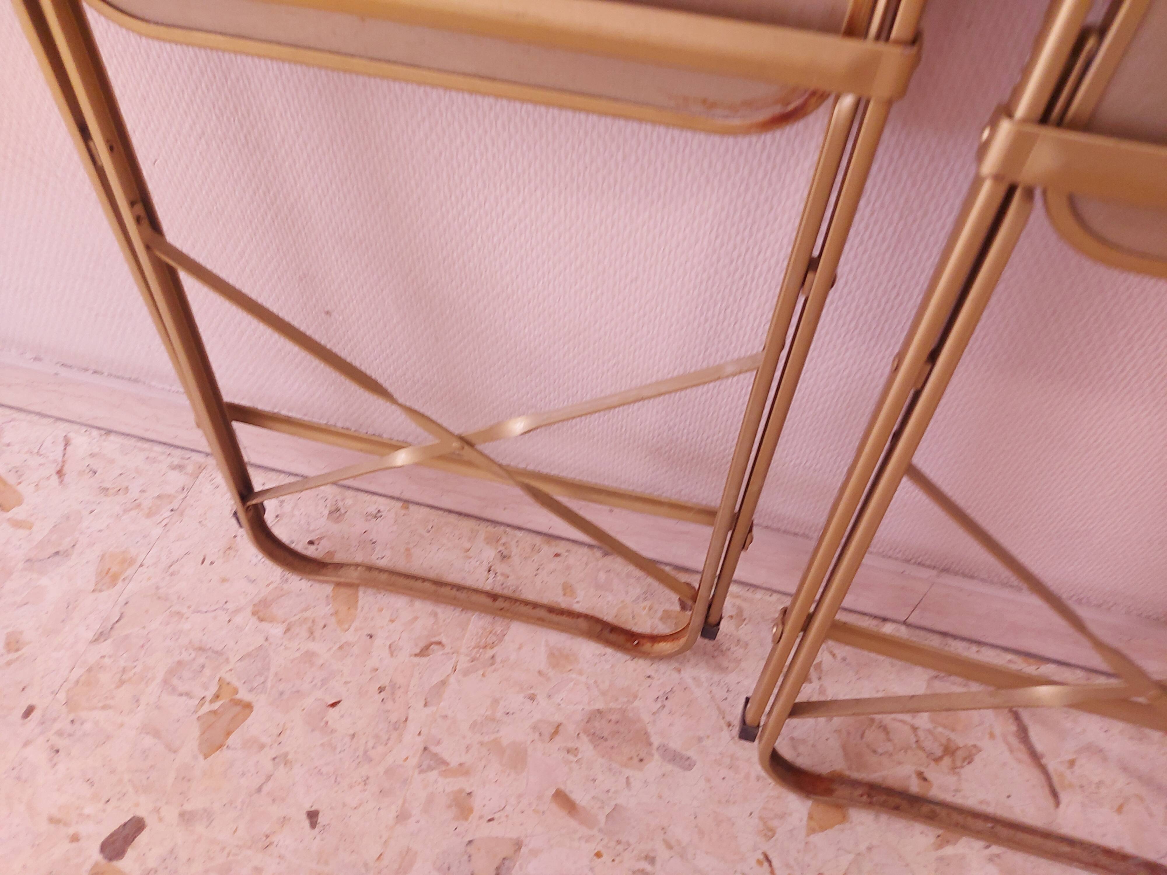 Two folding opera chairs in velvet