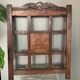 Art Deco wall-mounted coat rack in oak, early 20th century. Beveled central mirror