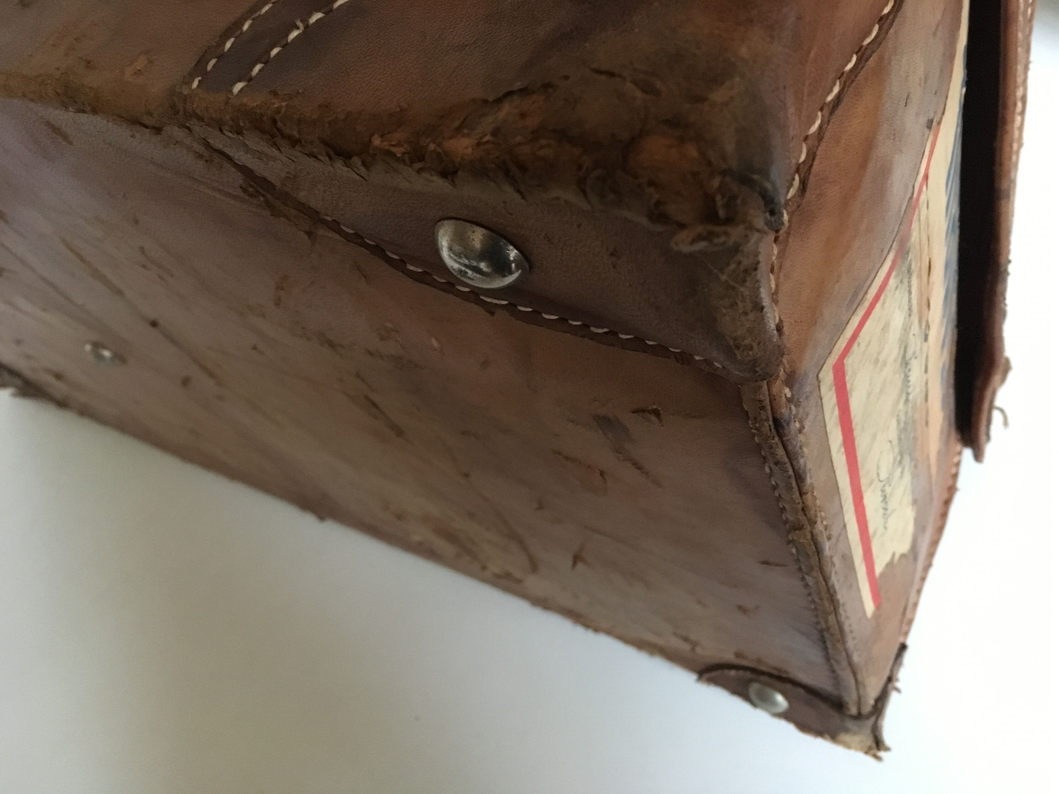 suitcase of leather with labels of palaces