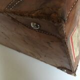 suitcase of leather with labels of palaces