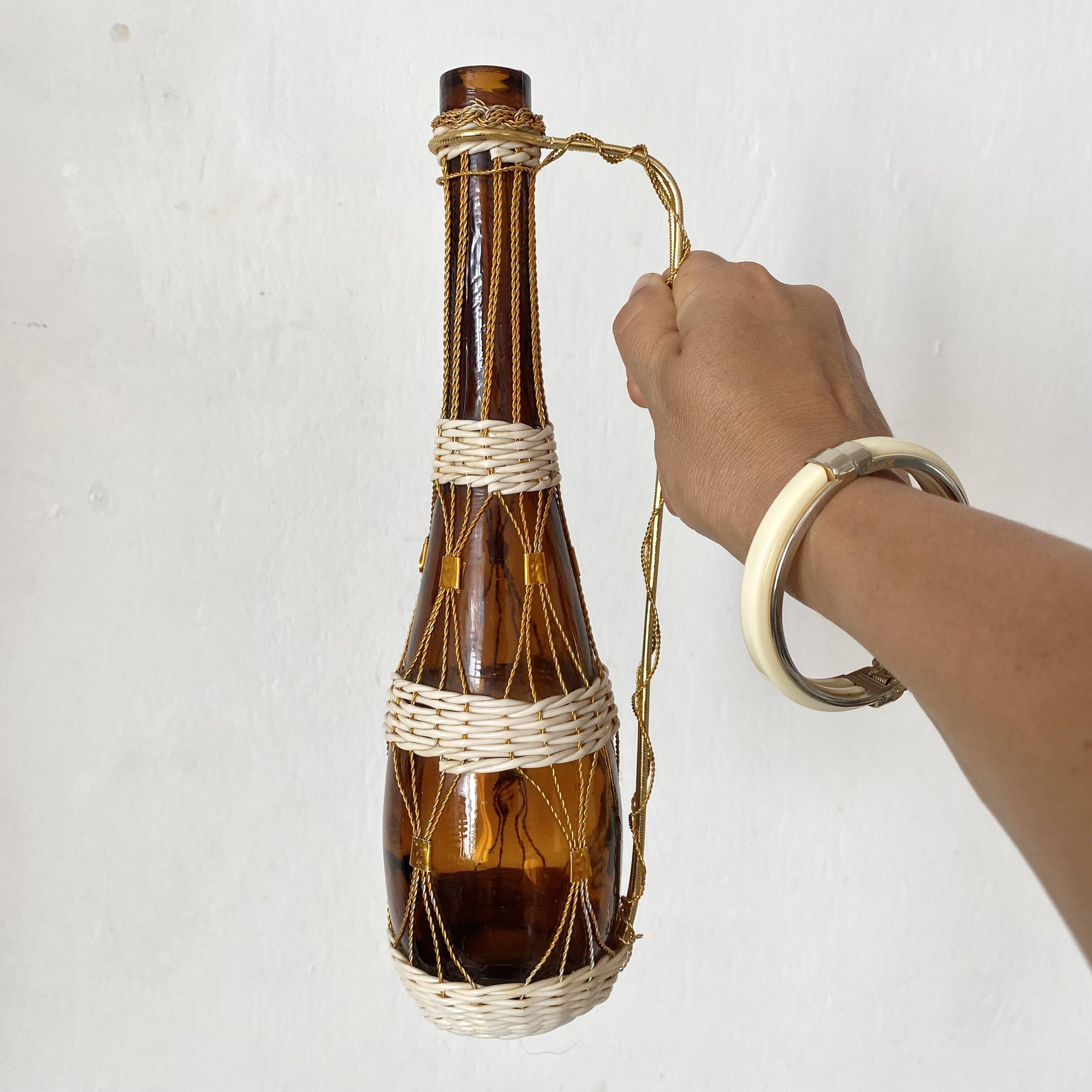 Amber glass bottle and scoubidou