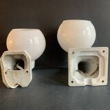 Pair of Art Deco porcelain wall lights with white Opaline globes, 1920