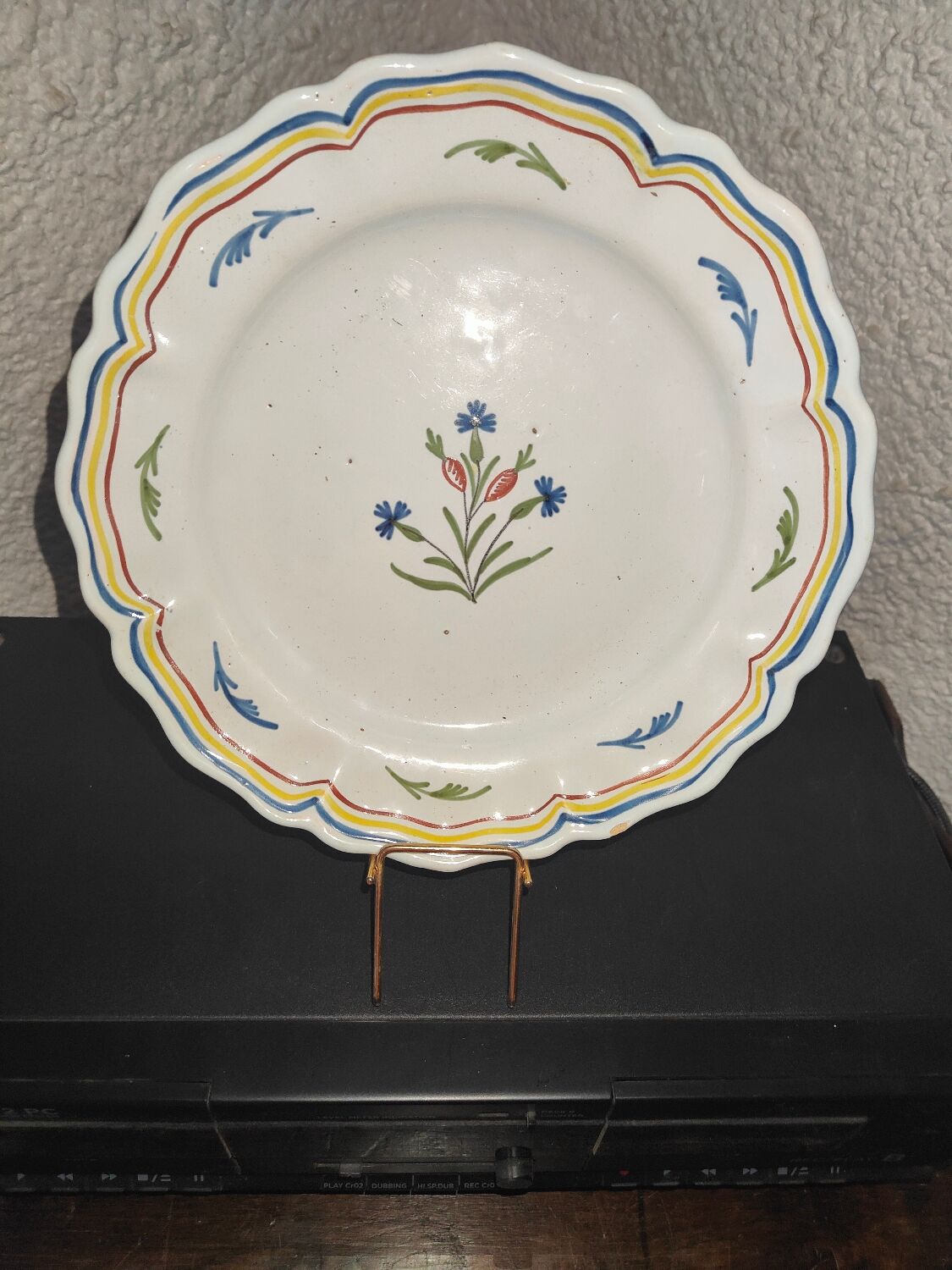 Old plate in earthenware of Nevers eighteenth Century with chantourné edges