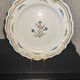 Old plate in earthenware of Nevers eighteenth Century with chantourné edges